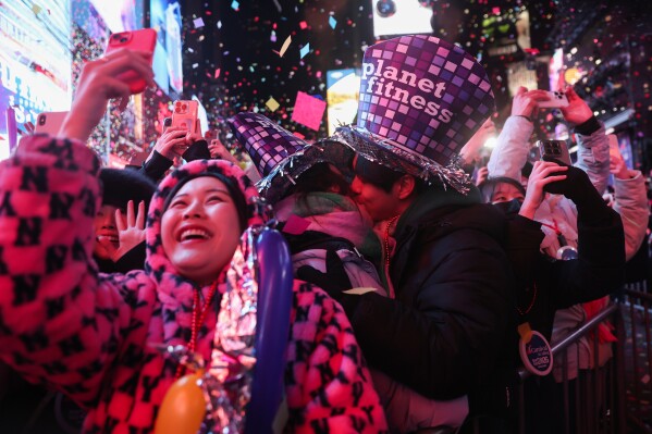 Revelers celebrate the start of 2026 after the ball drop in Times Square during New Year's Eve festivities, Thursday, Jan. 1, 2026, in New York. (AP Photo/Heather Khalifa)