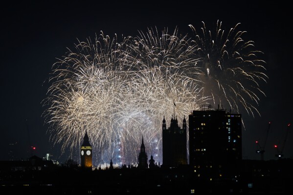 Fireworks light-up the sky in central London to celebrate the New Year on Thursday, Jan. 1, 2026. (AP Photo/Alberto Pezzali)