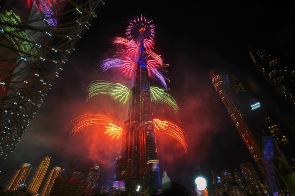 Fireworks explode around the Burj Khalifa, the world's tallest building, during New Year's Eve celebrations in Dubai, United Arab Emirates, Thursday, Jan. 1, 2026. (AP Photo/Fatima Shbair)
