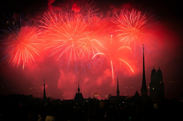 Fireworks illuminate the night sky over Zurich, Switzerland, during the New Year's Eve celebrations, Thursday, Jan. 1, 2026. (Andreas Becker/Keystone via AP)