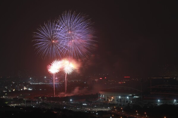 Fireworks are launched above the My Dinh national stadium in Hanoi, Vietnam, January 1, 2026. (AP Photo/Huy Han)