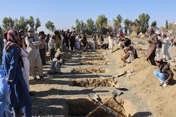 Locals prepare graves for victims of an overnight attack on a home that, according to an Afghan government spokesman, was carried out by Pakistan, in the Gurbaz district of Khost province, Afghanistan, Tuesday, Nov. 25, 2025. (AP Photo/Saifullah Zahir)
