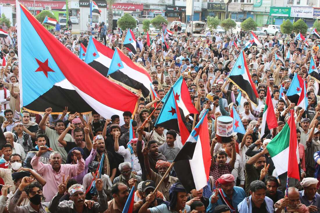 Supporters of the Southern Transitional Council (STC), a coalition of separatist groups seeking to restore the state of South Yemen, hold South Yemen flags during a rally, in Aden, Yemen, Friday.