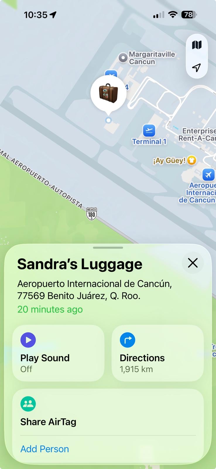 A map shows a suitcase and a pin dropped on a location in Cancun.