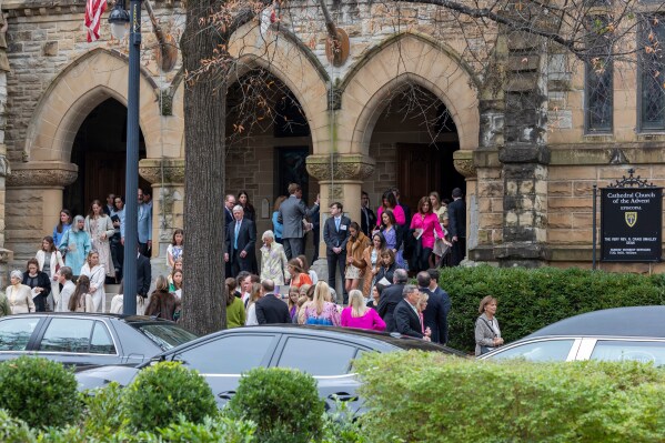 People depart a funeral service for Brown University shooting victim Ella Cook, Monday, Dec. 22, 2025, in Birmingham, Ala. (AP Photo/Vasha Hunt)
