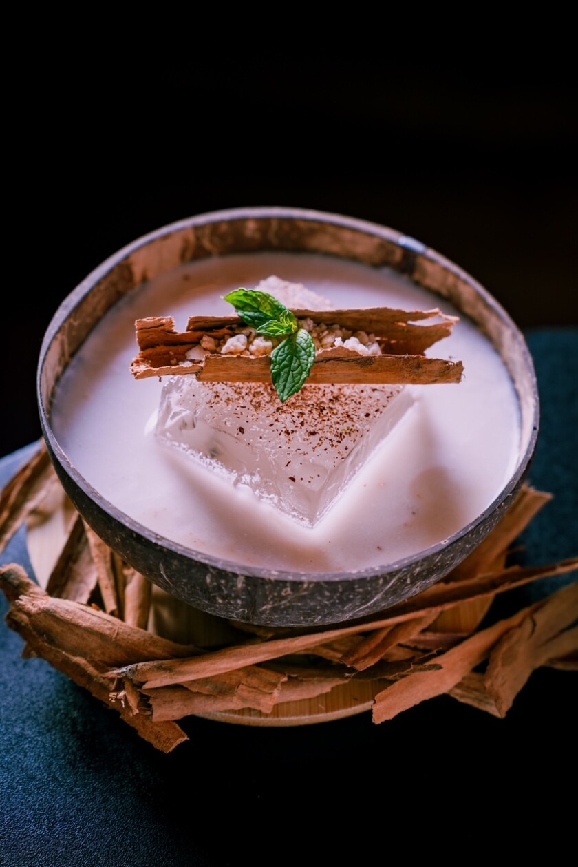Created by Sebastian Martínez, the coquito at Laberinto, an intimate speakeasy nestled under a Chicago steakhouse, incorporates peanuts and marzipan candy. 
