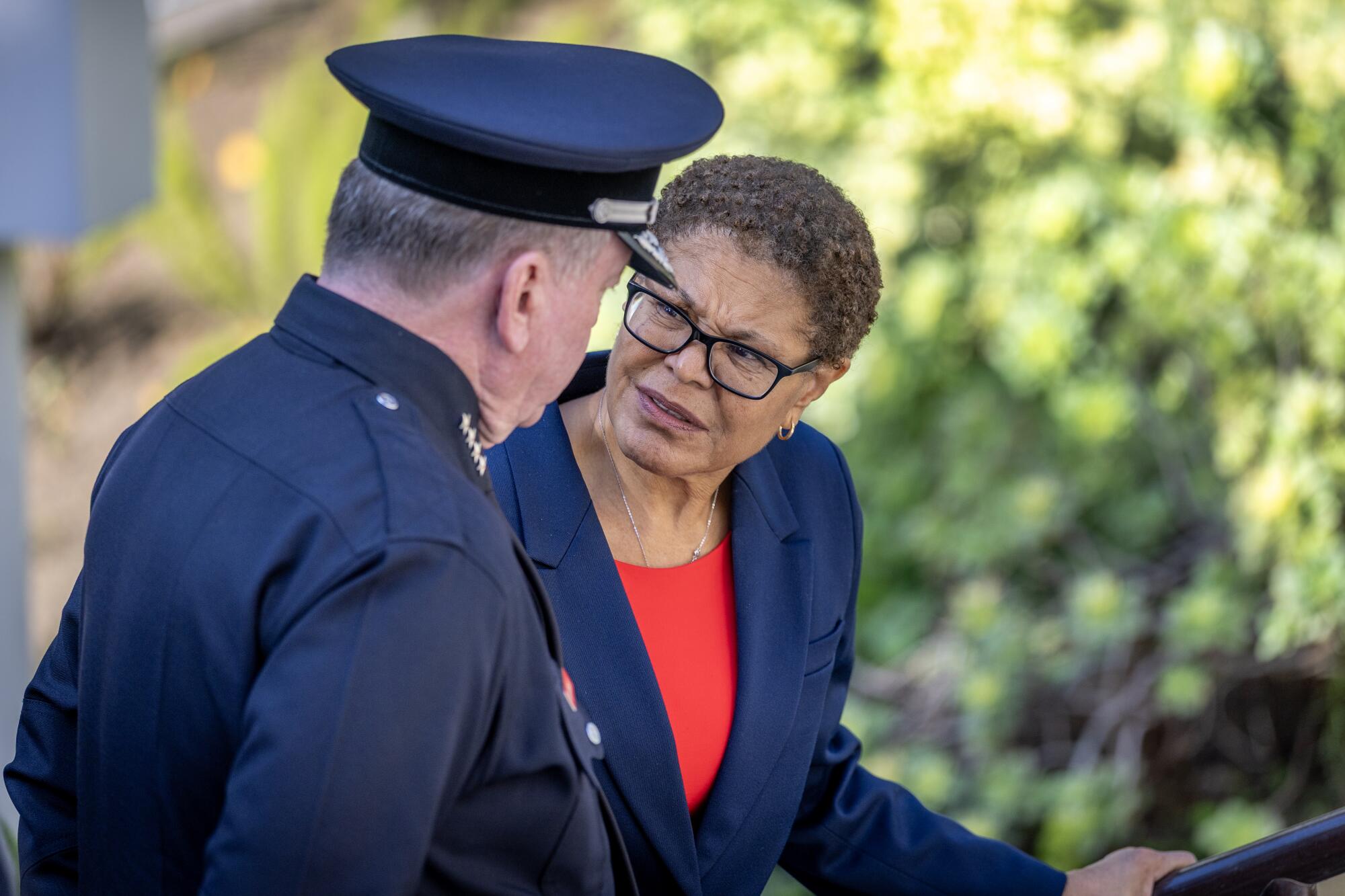 Los Angeles Police Chief Jim McDonald, left, speaks with Mayor Karen Bass.