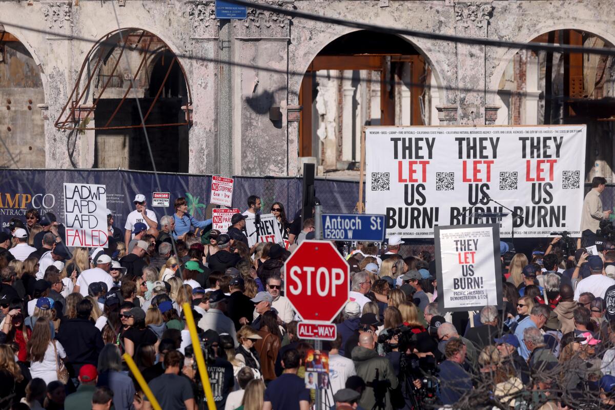 Hundreds of survivors gather in Palisades Village to commemorate the anniversary of the Palisades fire.
