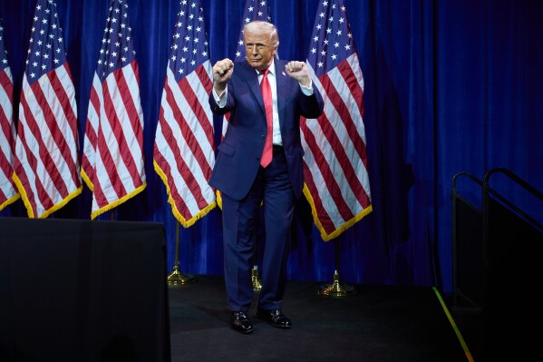 President Donald Trump dances as he walks off stage after speaking to House Republican lawmakers during their annual policy retreat, Tuesday, Jan. 6, 2026, in Washington. (AP Photo/Evan Vucci, File)