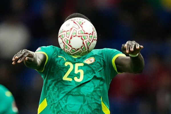 Senegal's El Hadji Malick Diouf heads the ball during the Africa Cup of Nations best of 16 soccer match between Senegal and Sudan in Tangier, Morocco, Saturday, Jan. 3, 2026. (AP Photo/Mosa'ab Elshamy, File)