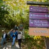 Visitors descend stairs after discovering the visitor center, park store and restrooms are closed at Acadia National Park, Wednesday, Oct. 1, 2025, in Maine.
