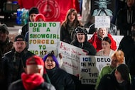Demonstrators react to a speaker at Civic Gardens Park during a protest against the U.S....
