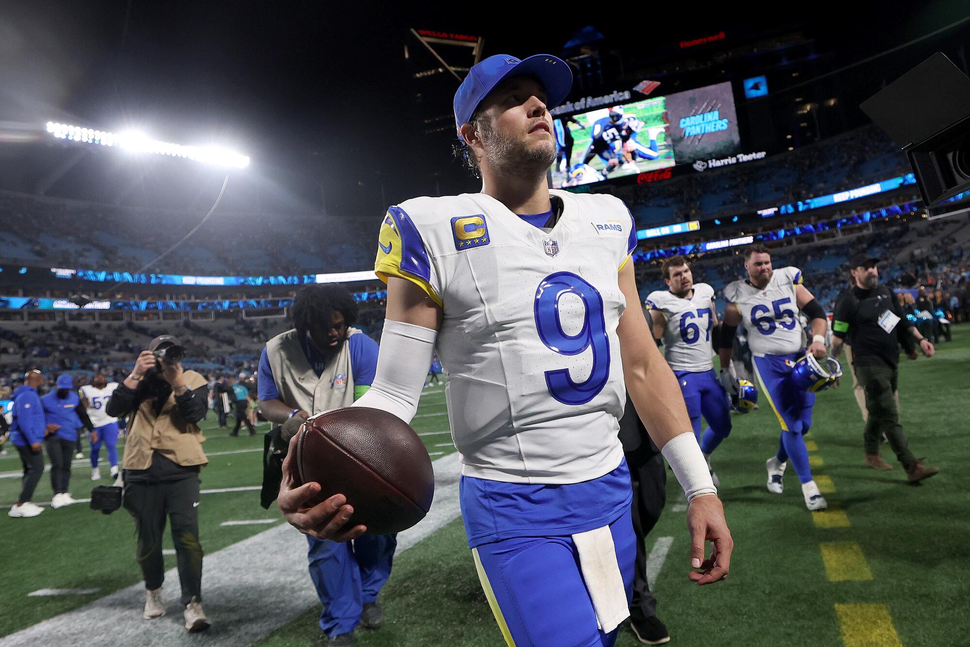 Rams quarterback Matthew Stafford walks off the field after a 34-31 playoff win over the Carolina Panthers on Saturday.