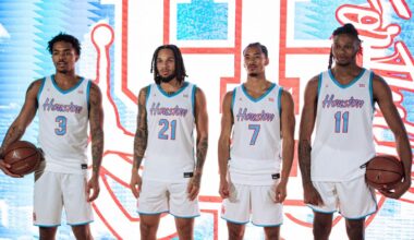 Joseph Tugler holding basketball vs Baylor