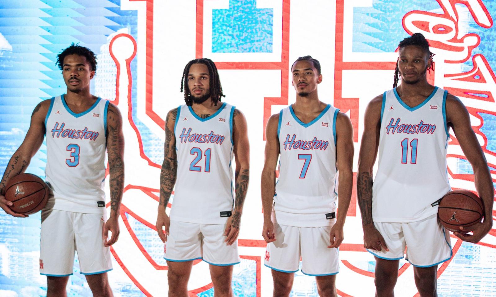 Joseph Tugler holding basketball vs Baylor