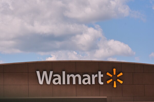 Clouds pass over the Walmart store, Thursday, Aug. 14, 2025, in Manchester, N.H. (AP Photo/Charles Krupa, File)