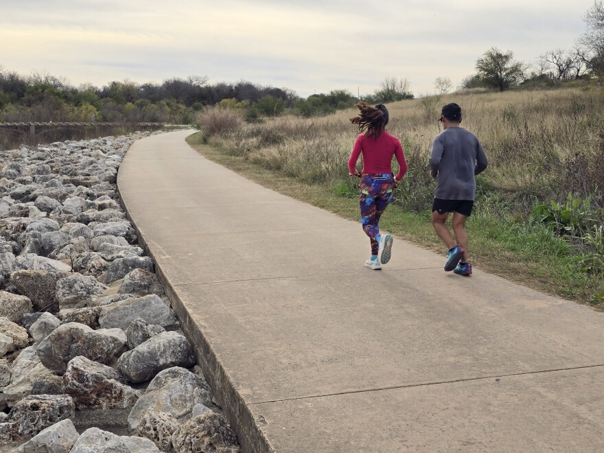 Runners along the San Antonio River and Padre Park