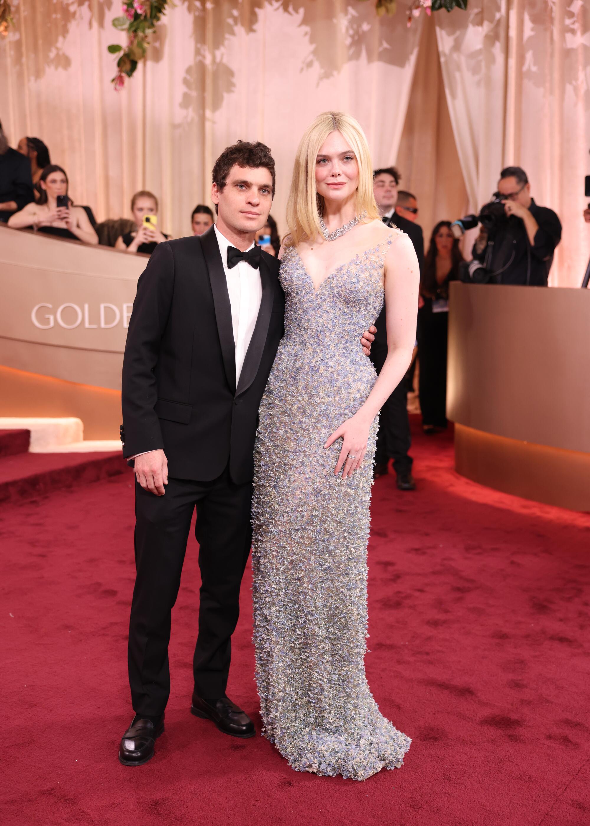 Elle Fanning and Gus Wenner pose on the red carpet. 