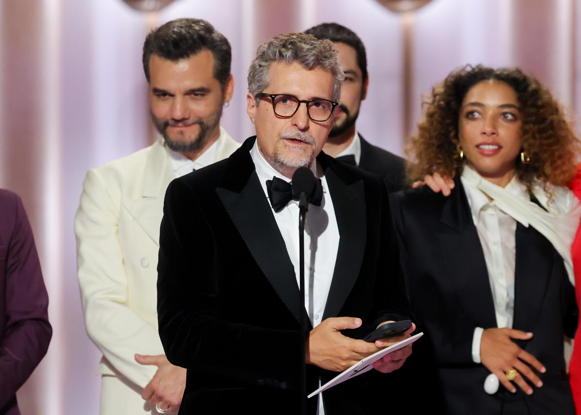 "The Secret Agent" director Kleber Mendonça Filho accepts the award for non-English language film.
