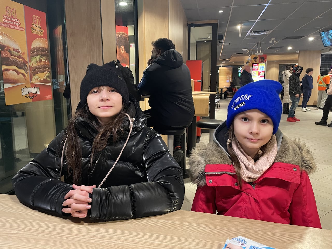 Two girls smile for the camera.