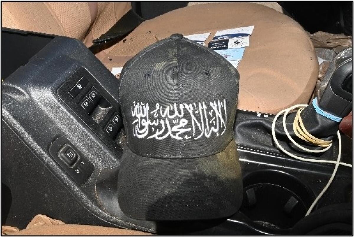 A hat with the calligraphy of the Al Qaeda flag was among evidence.