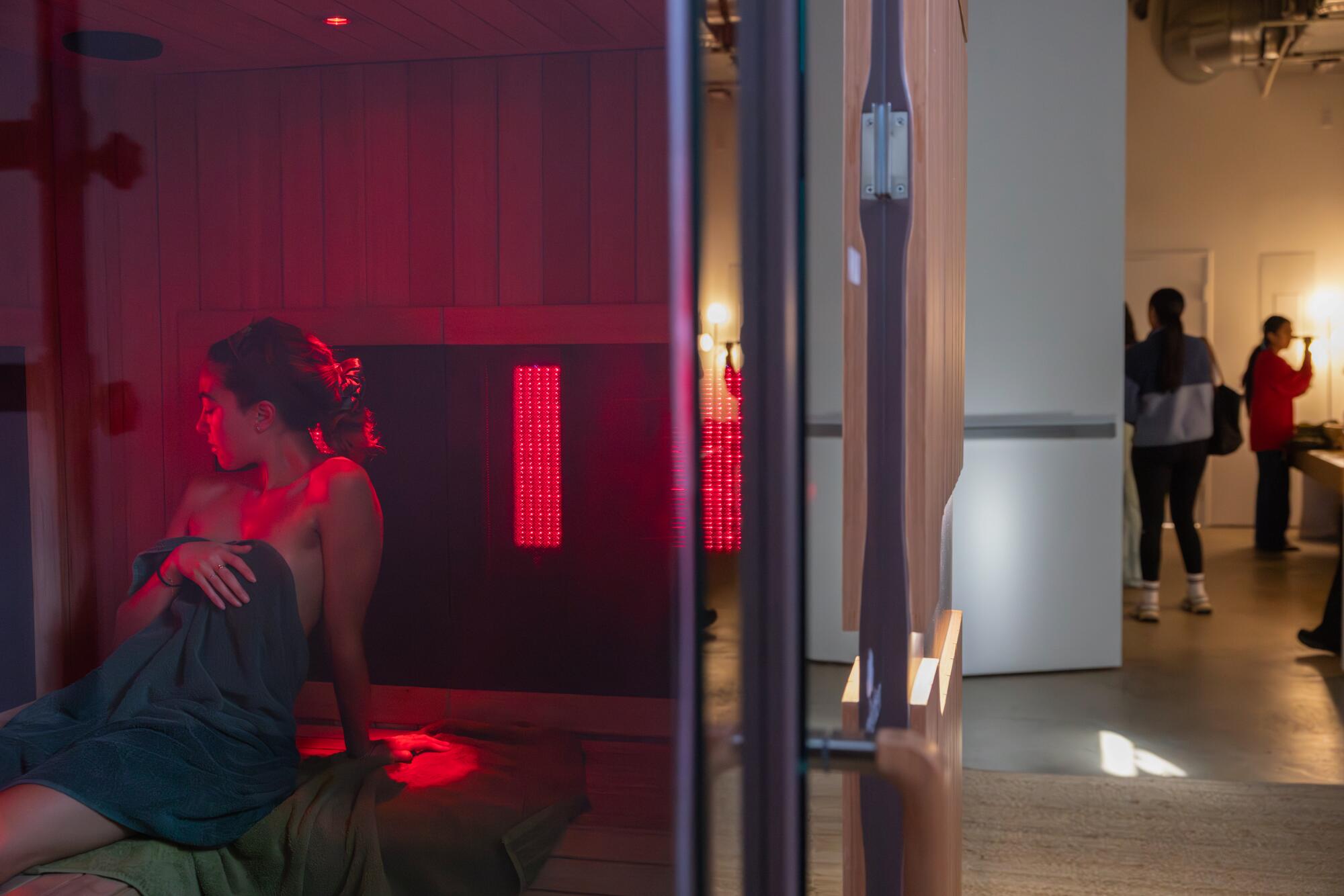 Malloy Moseley relaxes inside FOLM's infrared sauna.