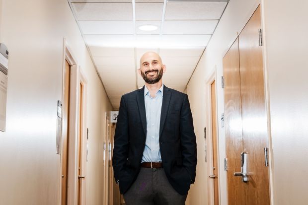 Dr. Ian Kratter stands in the hallway at the Stanford University Brain Stimulation Lab in Palo Alto, California, on January 12.(Carolyn Fong for CNN via CNN Newsource)