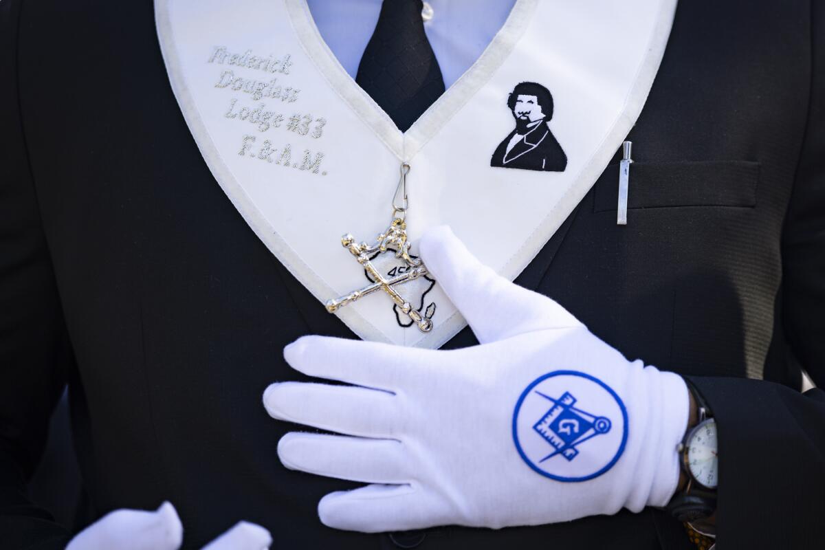 A member of the Grand Lodge of Free & Accepted Masons of California walks during Parade.