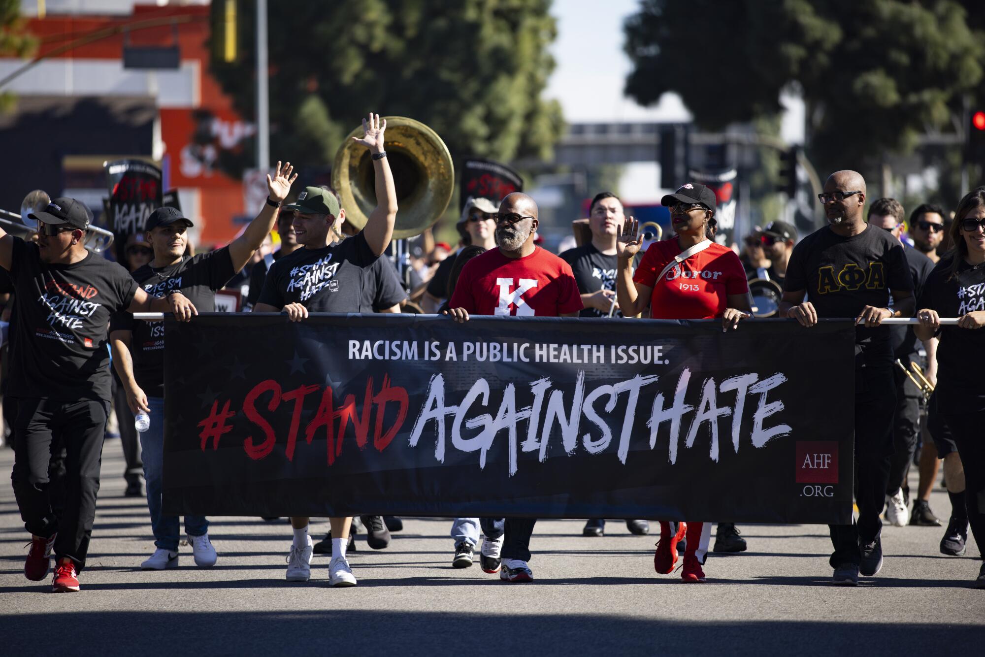 The Los Angeles-based AIDS Healthcare Foundation (AHF) walks during the Dr. Martin Luther King Jr. Day Parade.
