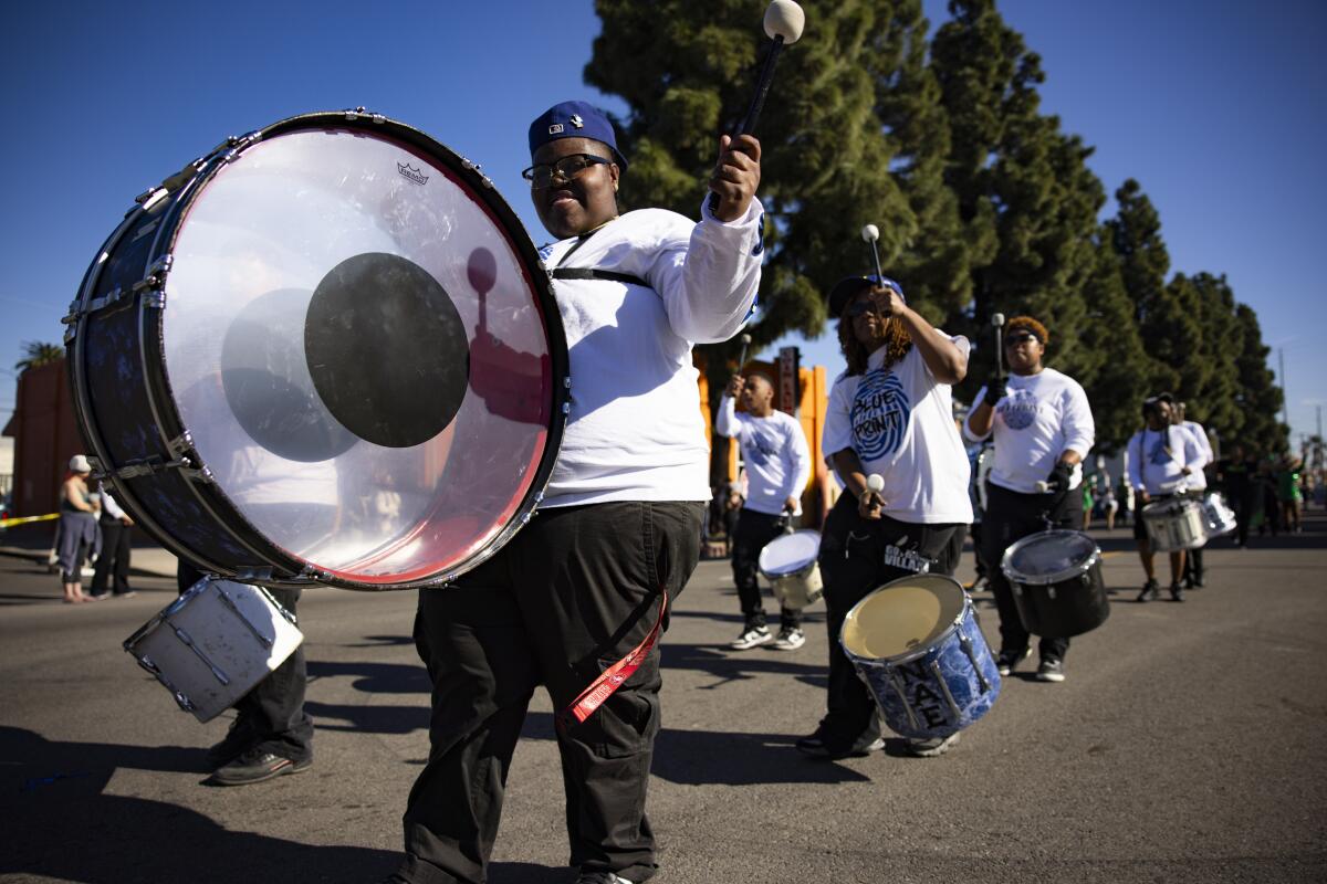 A drum line marches during the Dr. Martin Luther King Jr. Day Parade.