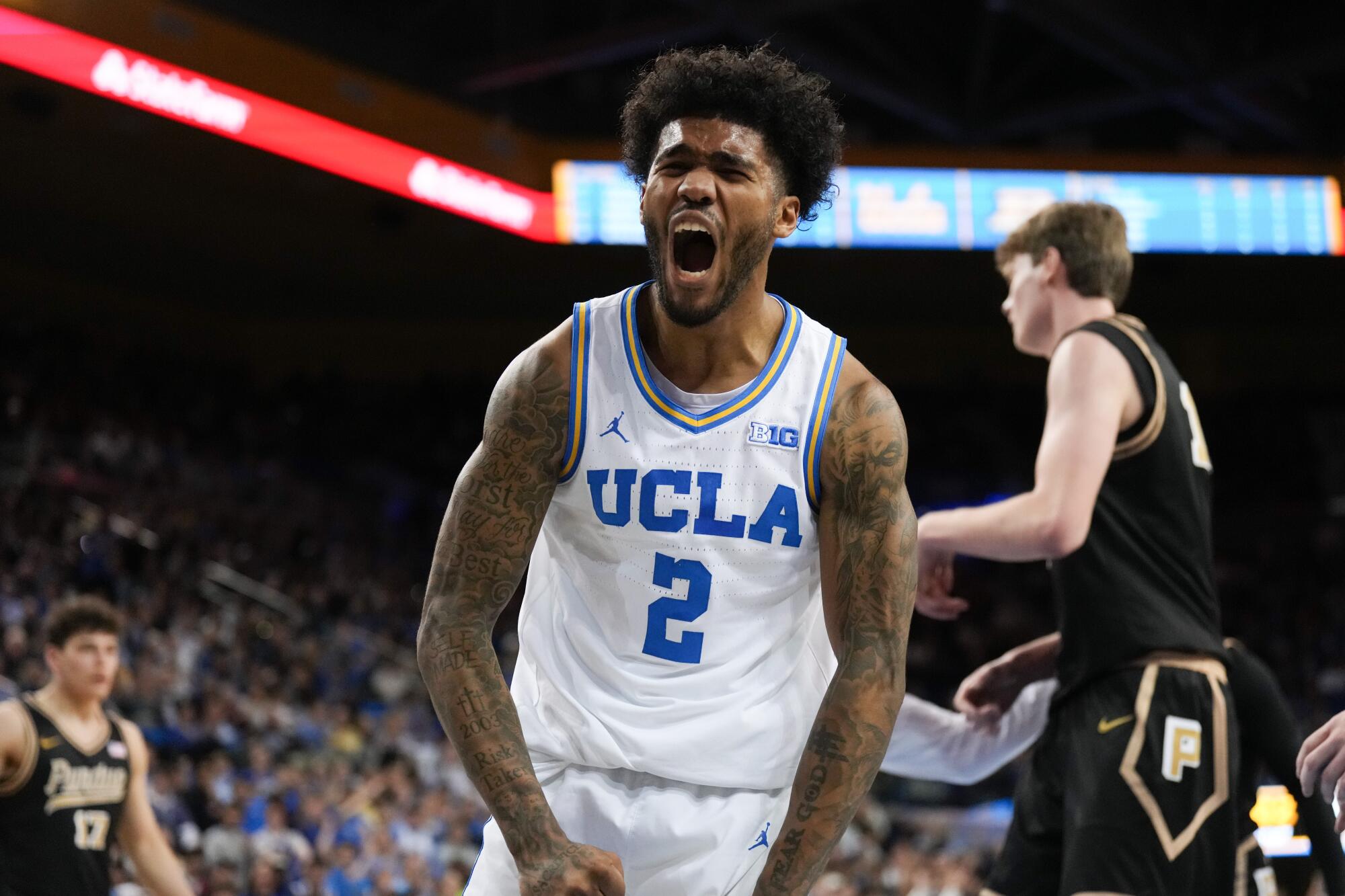 UCLA guard Donovan Dent celebrates after scoring during a win over No. 4 Purdue on Tuesday at Pauley Pavilion.