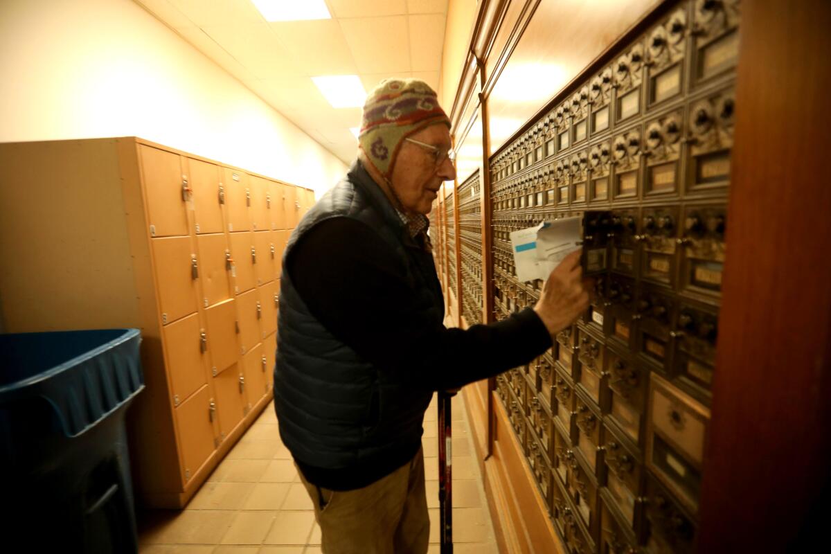 Hans Lehmann, then 91, collects mail from his Carmel-by-the-Sea post office box in January 2024.