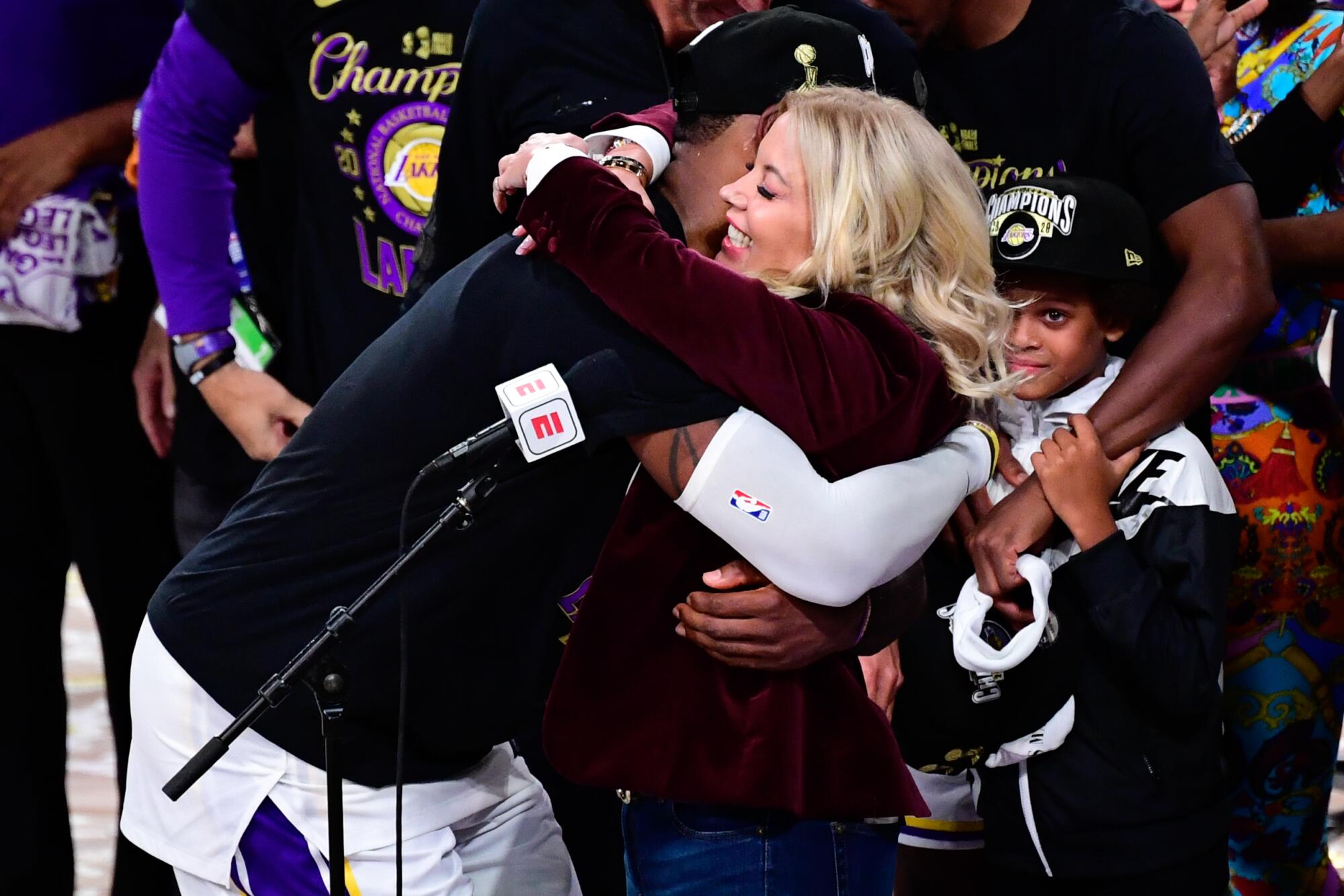 LeBron James hugs Jeanie Buss after the Lakers' NBA championship win on Oct. 11, 2020.