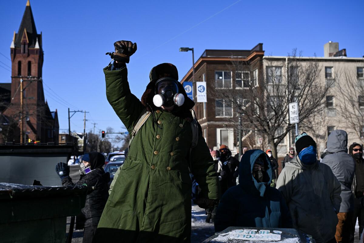 A protestor wears a gas mask