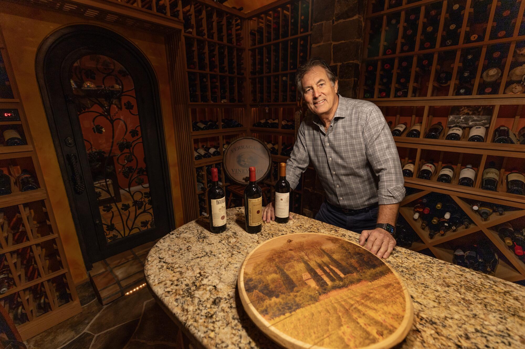 Vince Ferragamo stands in his home wine cellar in Orange County.