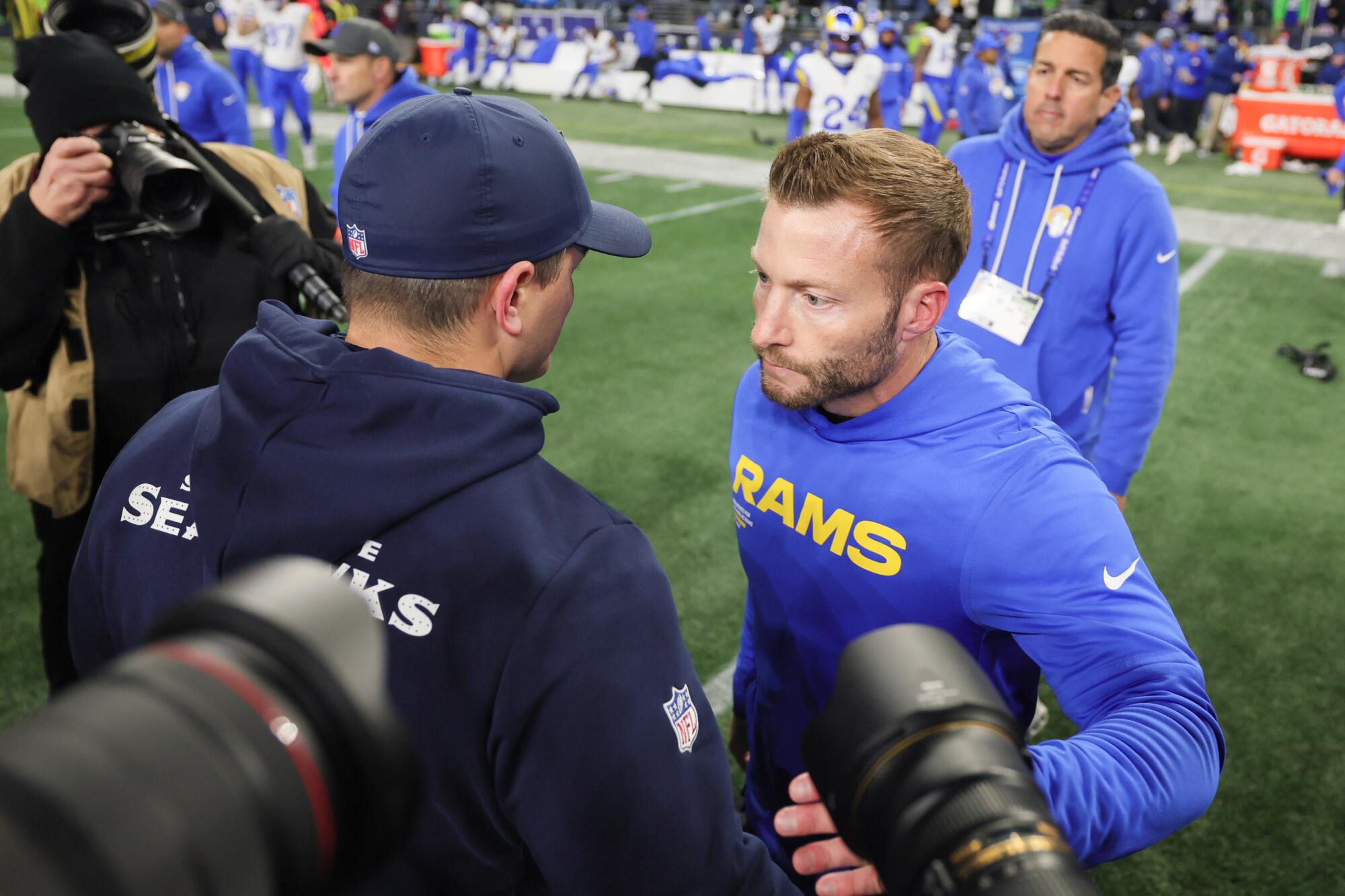 Rams coach Sean McVay, right, and Seattle Seahawks coach Mike Macdonald meet.