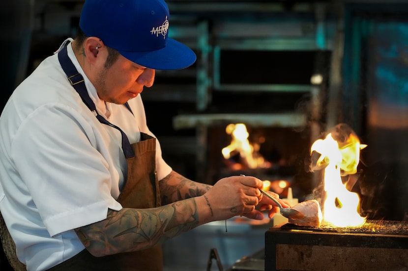 Chef Eduardo Osorio prepares Snake River White Sturgeon in the kitchen at Meridian on...