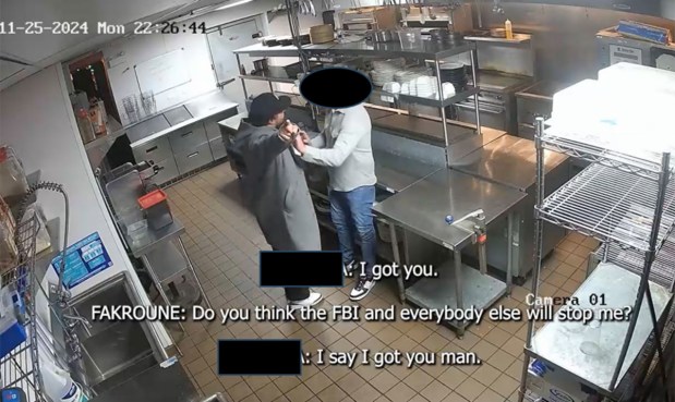 A surveillance image allegedly captured Jawad Fakroune, left, threatening and then beating a Chicago restaurateur on Nov. 25, 2024, over repayment of a $1.5 million loan. Fakroune was charged with extortion and flight to avoid prosecution. The image contains areas redacted in the court filing. (U.S. attorney's office)