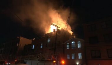 Firefighter suffers back injury in Jersey City apartment building fire