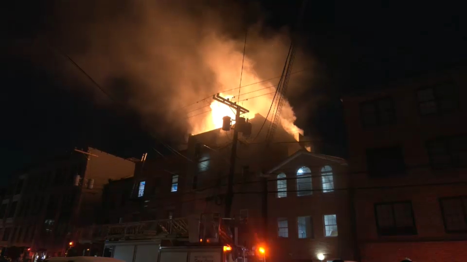 Firefighter suffers back injury in Jersey City apartment building fire