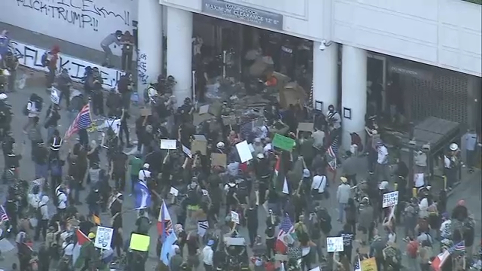 Live updates: Protesters clash with officers during 'ICE Out' protest in downtown LA