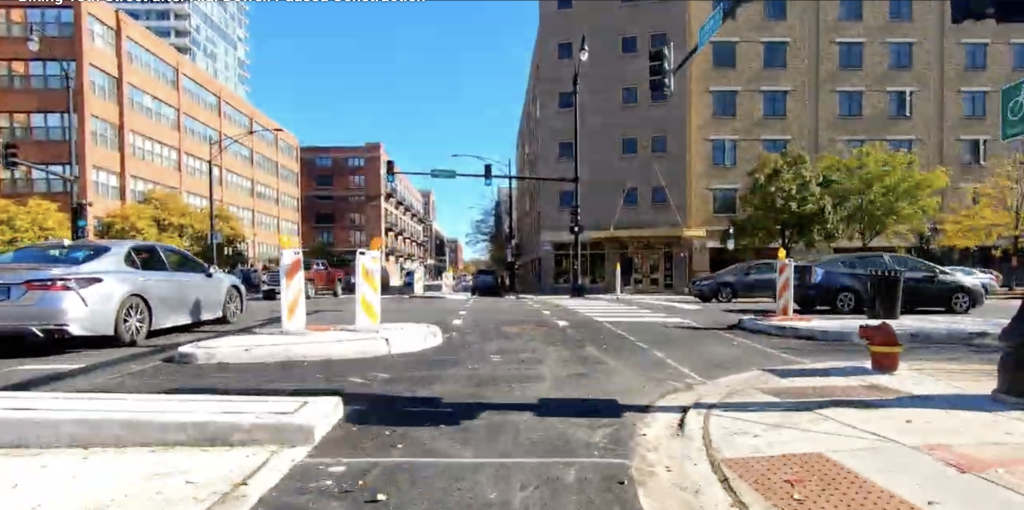 A still from a video of bike advocate Viktor Kövas biking 18th Street last fall. Kövas said the protected bike lanes have had a positive impact on traffic at the intersection.