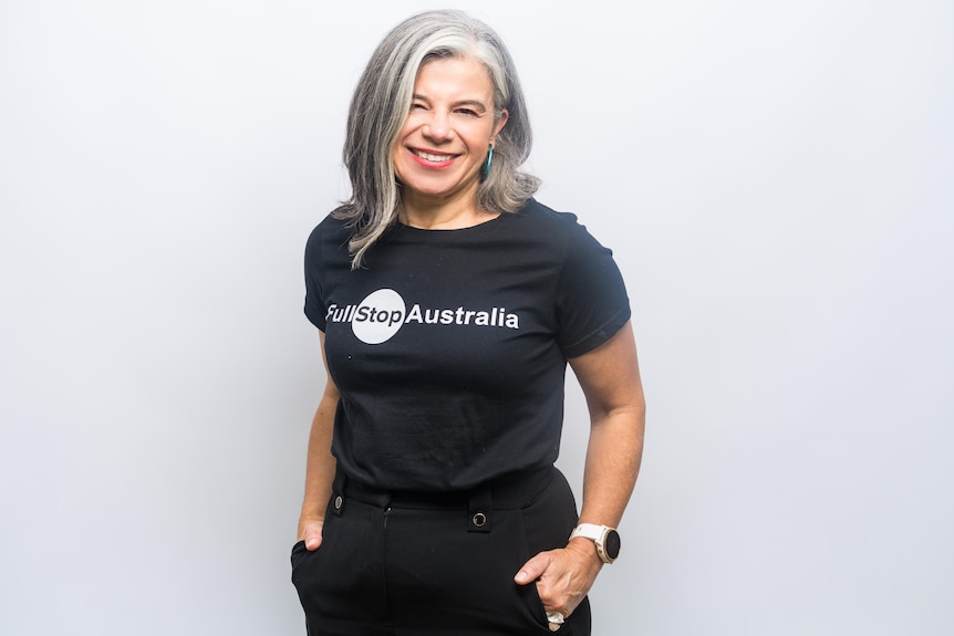 Karen Bevan wearing a black top that says 'Full Stop Australia'.