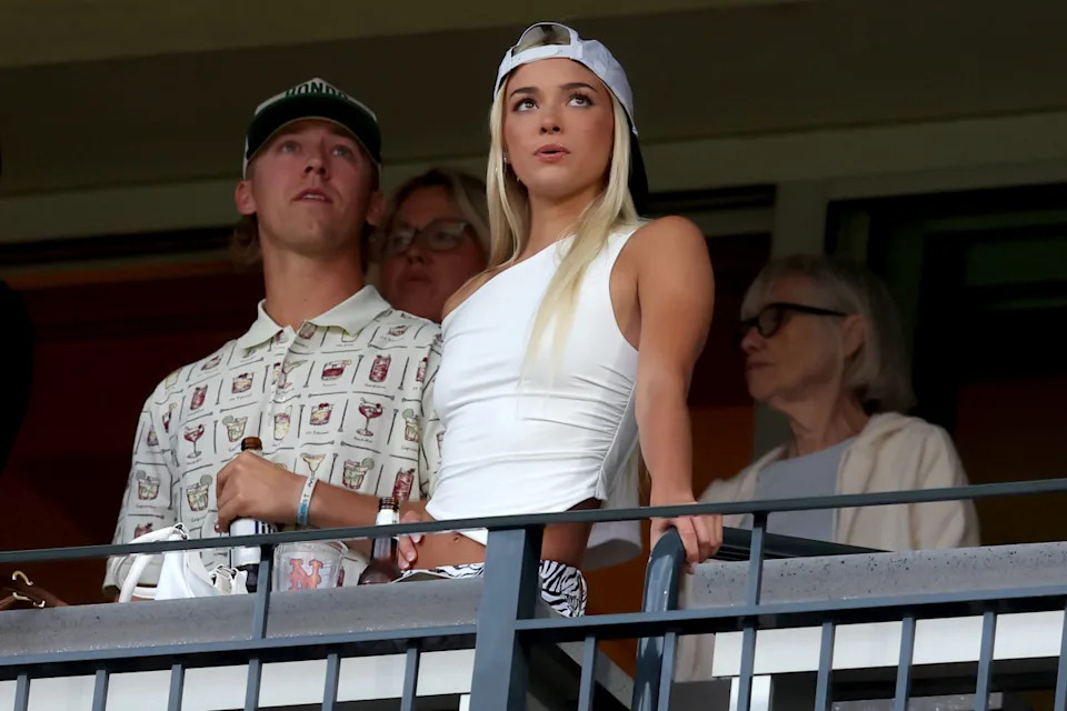 May 12, 2025; New York City, New York, USA; LSU former gymnast Olivia Dunne watches the game between the New York Mets and the Pittsburgh Pirates during the second inning at Citi Field. Mandatory Credit: Brad Penner-Imagn Images