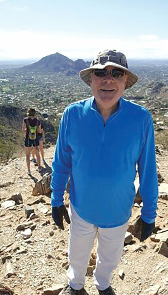 Frank Morris stands atop the Phoenix Mountain Preserve. Morris was about to hike Sept. 14 when he was assaulted by a cyclist in Paradise Valley. The Paradise Valley Police apprehended the cyclist about a week later. Now the case is closed.