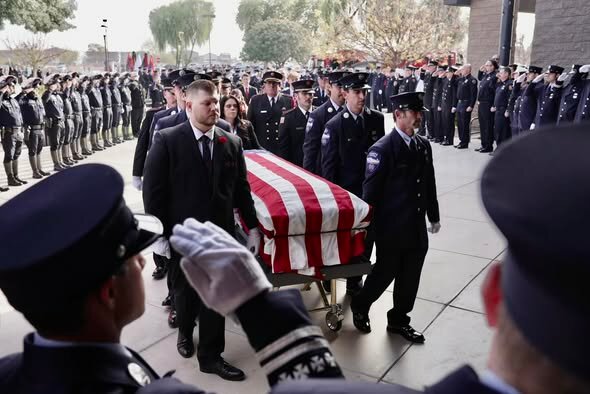 Fourteen fallen firefighters will be remembered Jan. 11 during a ceremony at Wesley Bolin Plaza in Phoenix. This is a photo of the funeral service for Scott Leatham, a Tempe firefighter, who died from occupational cancer.