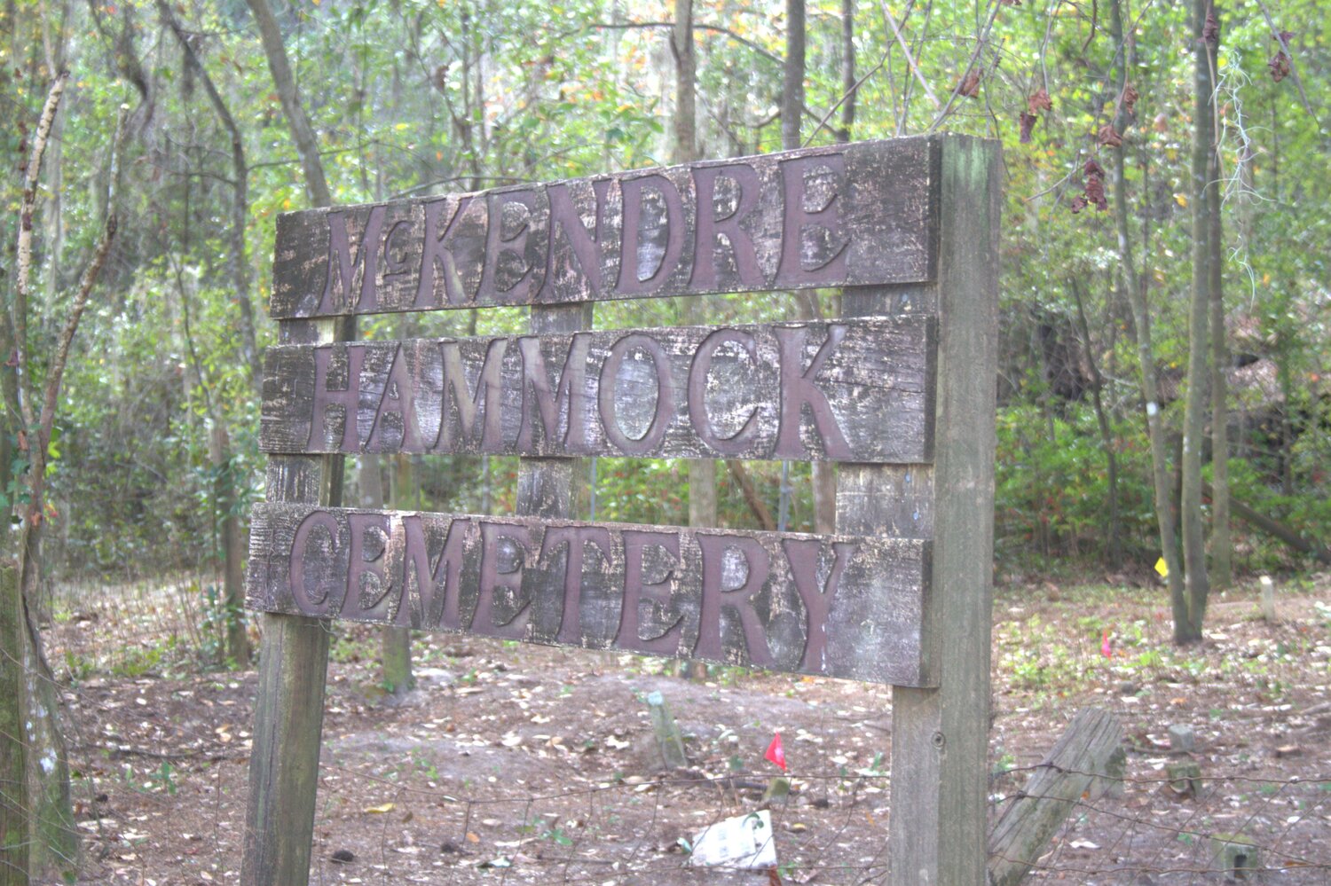 The sign marking McKendre Hammock Cemetery was covered by brush, bushes and vines. The family cemetery was restored by Boy Scout Troup 482 as part of the Eagle Scout Project by Caleb Martens.
