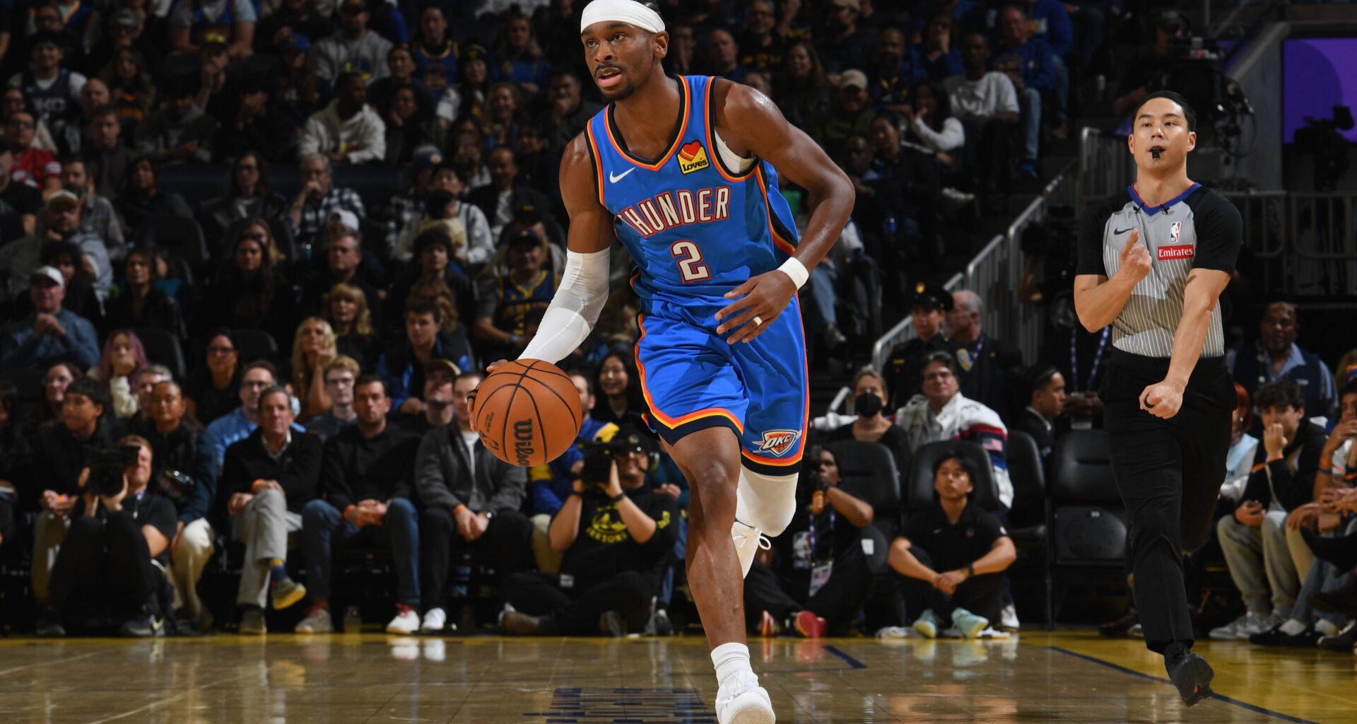 Shai Gilgeous-Alexander dribbles the ball