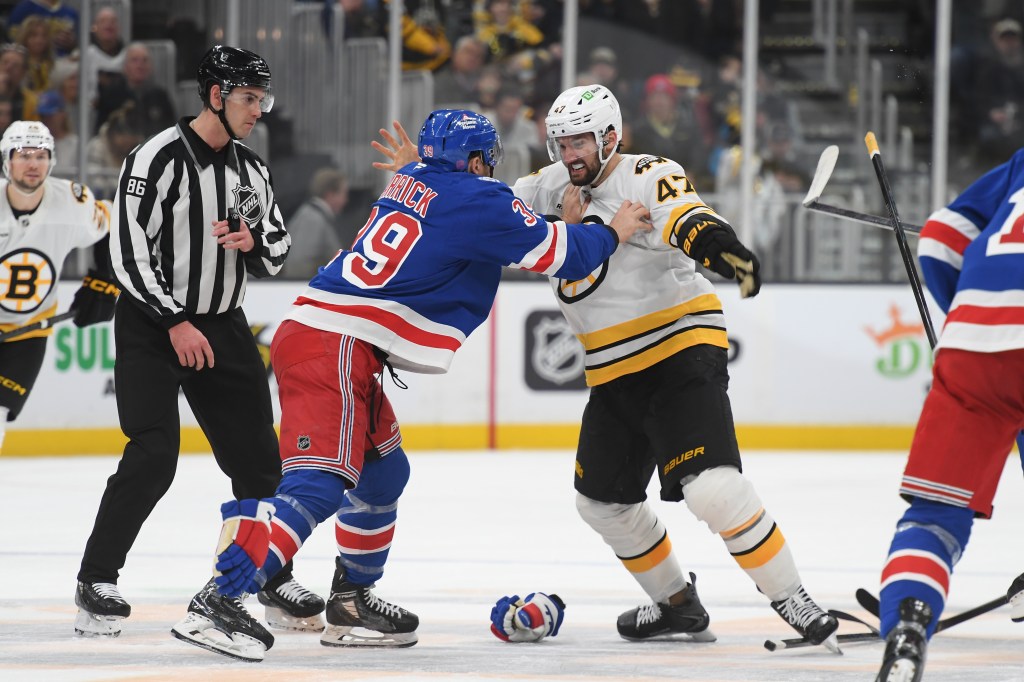 Mark Kastelic #47 of the Boston Bruins fightsSam Carrick #39 of against the New York Rangers at the TD Garden on January 10, 2026 in Boston, Massachusetts.