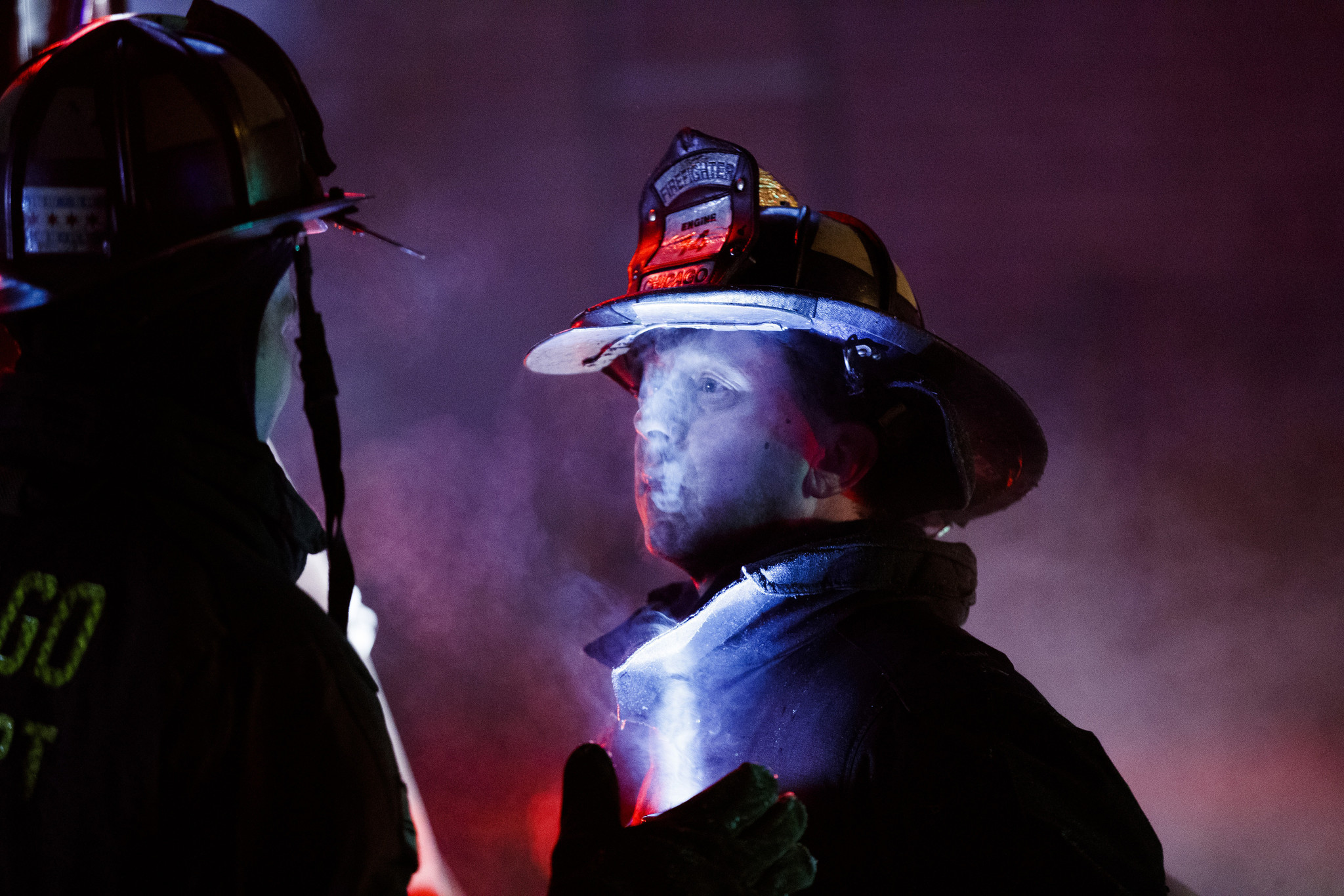 Firefighters work at the scene of a fire on the...